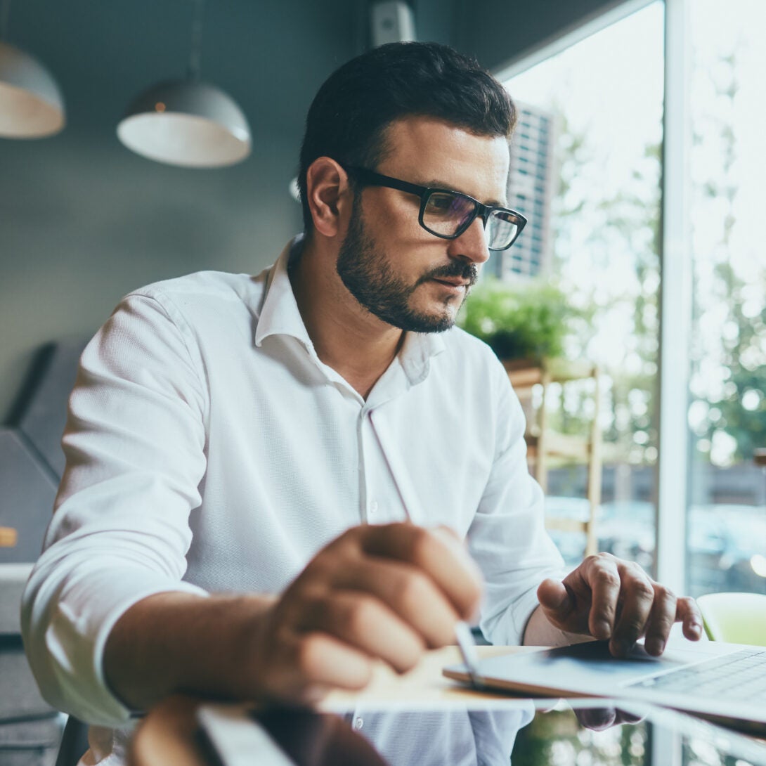 Health Informatics professional works at computer