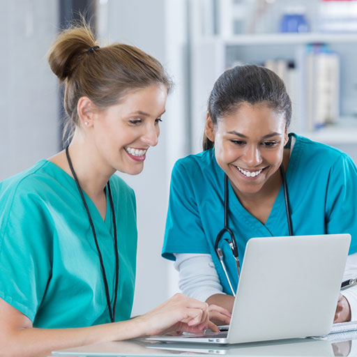 nurses working on laptop