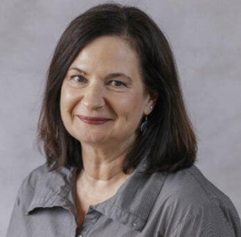 UIC Clinical Assistant Professor Barbara Glondys smiles at camera 